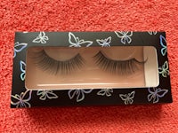 a pair of false eyelashes in a black box