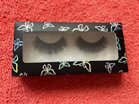 a pair of false eyelashes in a black box