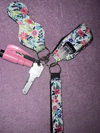 a key holder with a pink key and a pink key