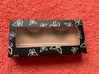 a pair of false eyelashes in a black box